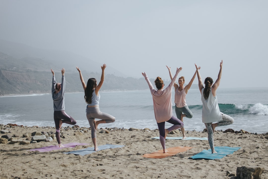 Group at a yoga class by the seashore