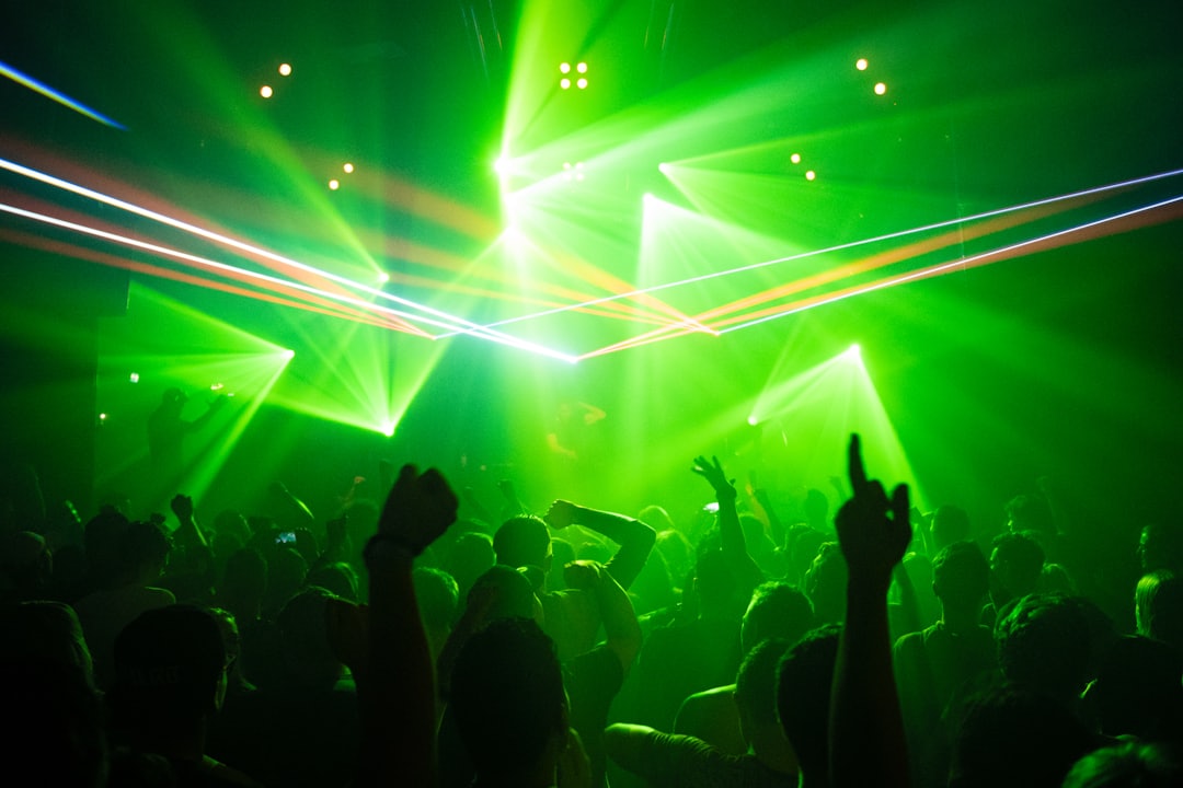 People dancing in a club with lights