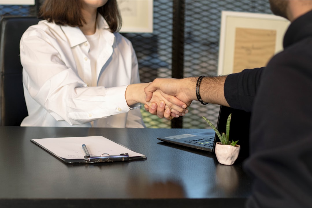 Business professionals shaking hands in an office