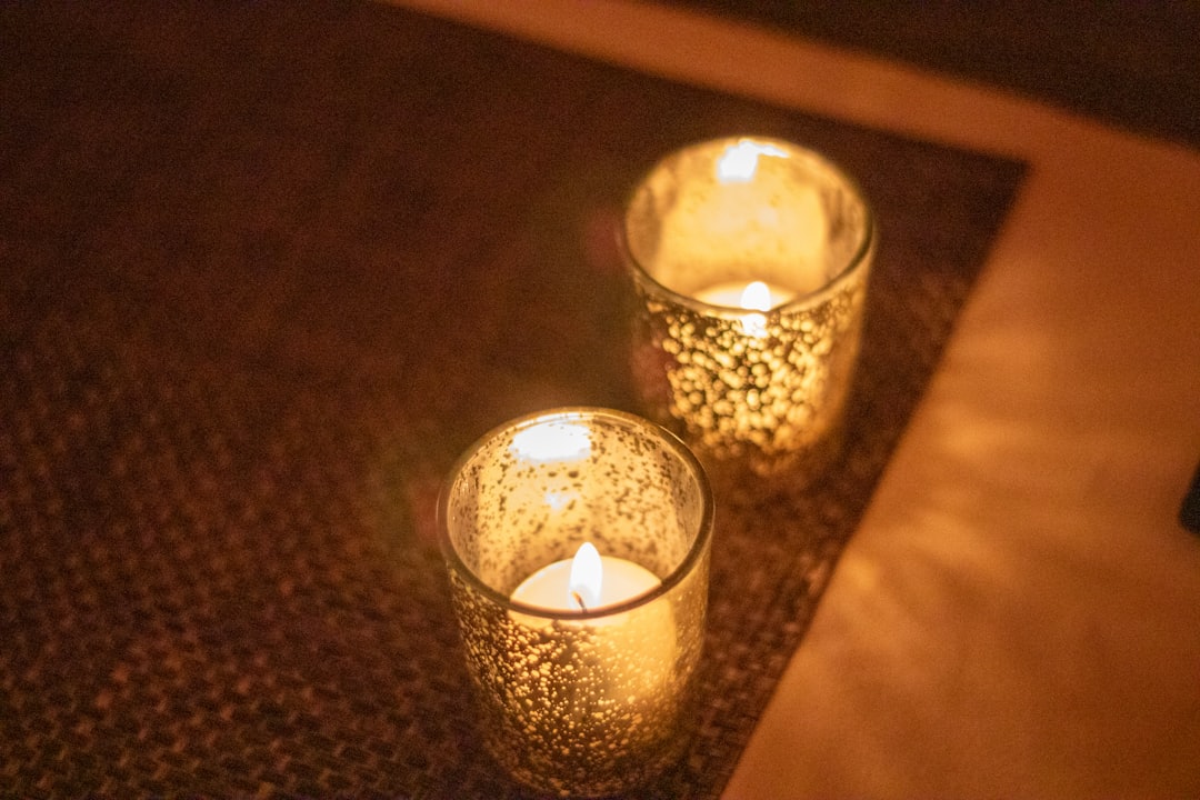 Softly lit wellness candles
